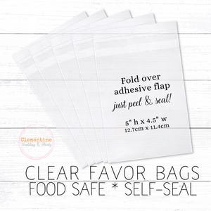 5 clear favor bags are fanned out on a white wood background.  Overlay text:  “CLEAR FAVOR BAGS * FOOD SAFE * SELF SEAL, 5”h x 4.5”w, 12.7cm x 11.4cm. Fold over adhesive flap - just peel and seal!”
