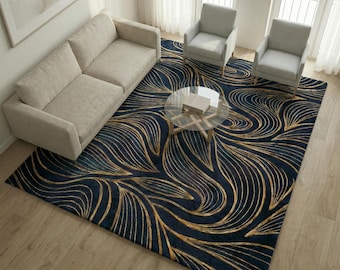 May include: A navy blue area rug with a gold leaf design. The rug is in a living room setting with a beige sofa, two gray armchairs, and a glass coffee table. The rug's pattern creates a flowing, organic aesthetic.