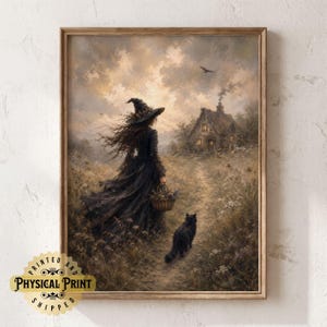 May include: A framed wall art print depicting a person in a dark dress and pointed hat walking through a field with a basket, accompanied by a black cat. In the background, a small cottage sits under a cloudy sky with a bird flying above.