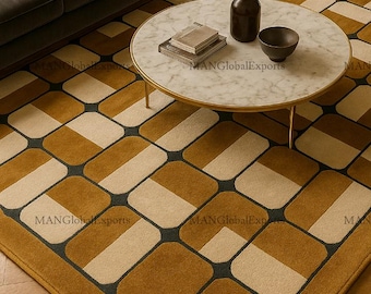 May include: A mustard yellow and cream-colored geometric patterned rug. The rug features a repeating pattern of rounded rectangles in mustard yellow and cream, outlined in dark gray. The rug is placed in a living room setting with a sofa and coffee table.