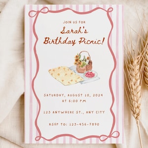 May include: A rectangular invitation with a pink border and vertical stripes. The text reads "Join us for Sarah's Birthday Picnic!" with the date, time, and RSVP information. A watercolor illustration of a picnic basket and food is included.