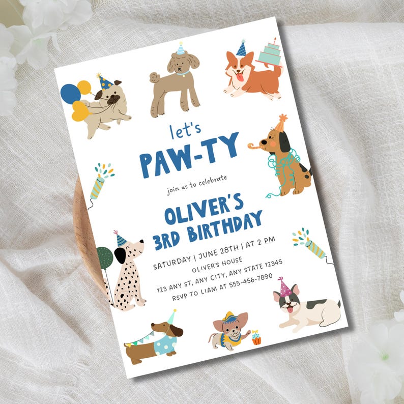 May include: A rectangular birthday invitation card featuring illustrations of various dog breeds wearing party hats. The text reads: let's PAW-TY join us to celebrate OLIVER'S 3RD BIRTHDAY SATURDAY | JUNE 28TH | AT 2 PM OLIVER'S HOUSE 123 ANY ST, ANY CITY, ANY STATE 12345 RSVP TO LIAM AT 555-456-7890.