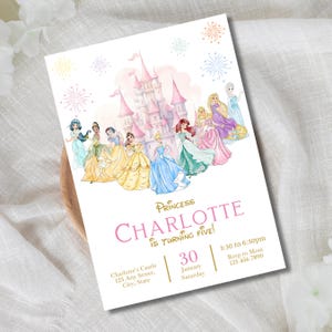 May include: A white invitation card featuring a pink castle and watercolor illustrations of Disney princesses. The text reads "Princess Charlotte is Turning Five!" with event details. Decorative fireworks are in the background.