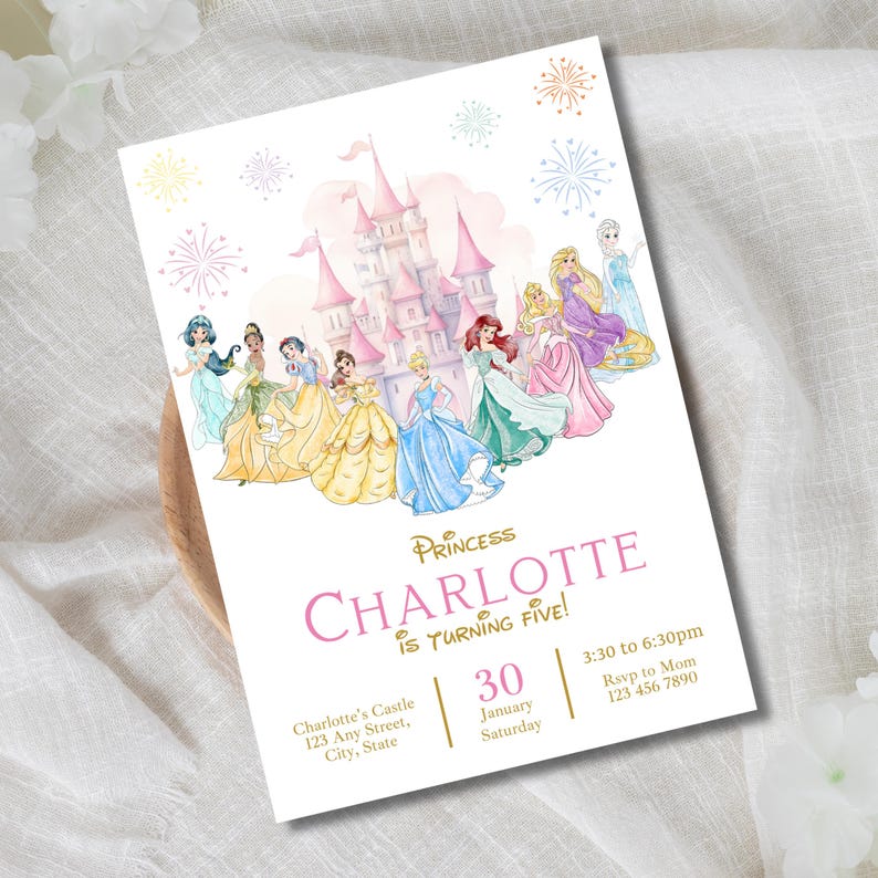 May include: A white invitation card featuring a pink castle and watercolor illustrations of Disney princesses. The text reads "Princess Charlotte is Turning Five!" with event details. Decorative fireworks are in the background.