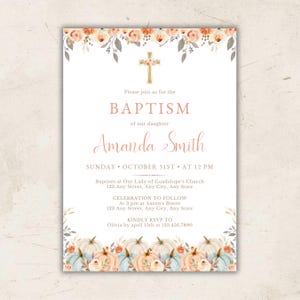 May include: A baptism invitation card featuring a gold cross, floral accents in peach and cream, and pumpkins at the bottom. The text reads: Please join us for the BAPTISM of our daughter Amanda Smith, Sunday October 31st at 12 PM, Our Lady of Guadalupe's Church, 123 Any Street, Any City, Any State, Celebration to follow at 3 pm at Aaron's Bistro, RSVP to Olivia by April 15th at 123.456.7890.