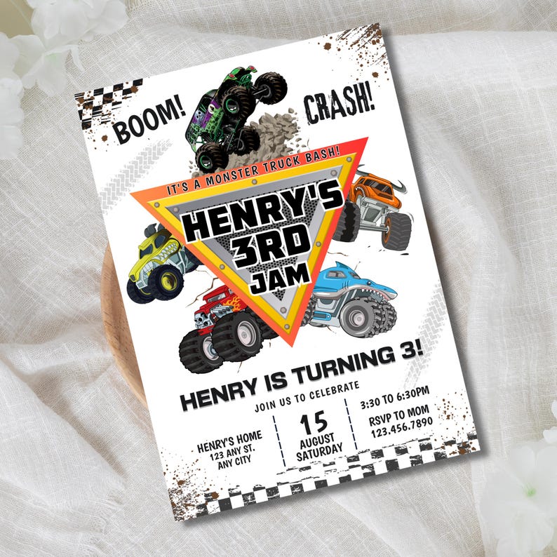 May include: A white invitation card with a monster truck theme. The card features colorful monster truck illustrations, the text "HENRY'S 3RD JAM", and event details. The design includes "BOOM!" and "CRASH!" text elements.