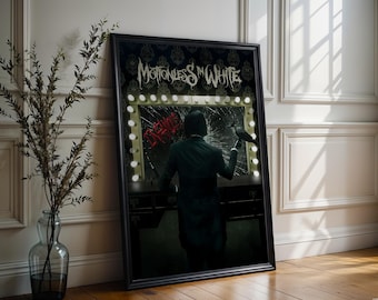 May include: A framed poster featuring the band "Motionless In White." The poster depicts a person in a dark green suit holding a crow in front of a broken mirror with the word "DEVA" in red. The mirror is surrounded by lights.