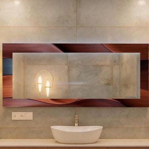 May include: A contemporary bathroom interior with a large rectangular mirror framed in dark wood. Two wall-mounted lamps with cream shades are either side of the mirror. A white oval sink is below the mirror, with a light-coloured countertop.