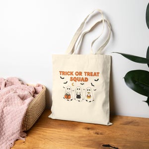 Trick or Treat Squad Canvas Tote Bag: Kids Halloween Ghost Trio Design