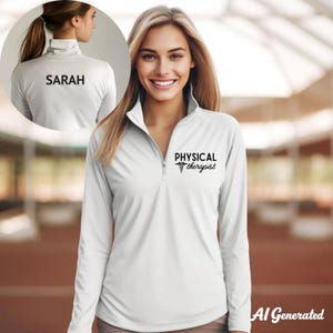 May include: A white long-sleeve shirt with a quarter-zip collar. The shirt features the text "PHYSICAL therapist" with a caduceus symbol on the front and the name "SARAH" on the back. The shirt is designed for a physical therapist.