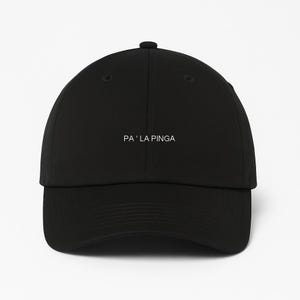 May include: Black baseball cap with a curved brim and adjustable strap. The text "PA ' LA PINGA" is printed in white on the front of the cap. The cap is made of a durable fabric and has a classic, casual style.
