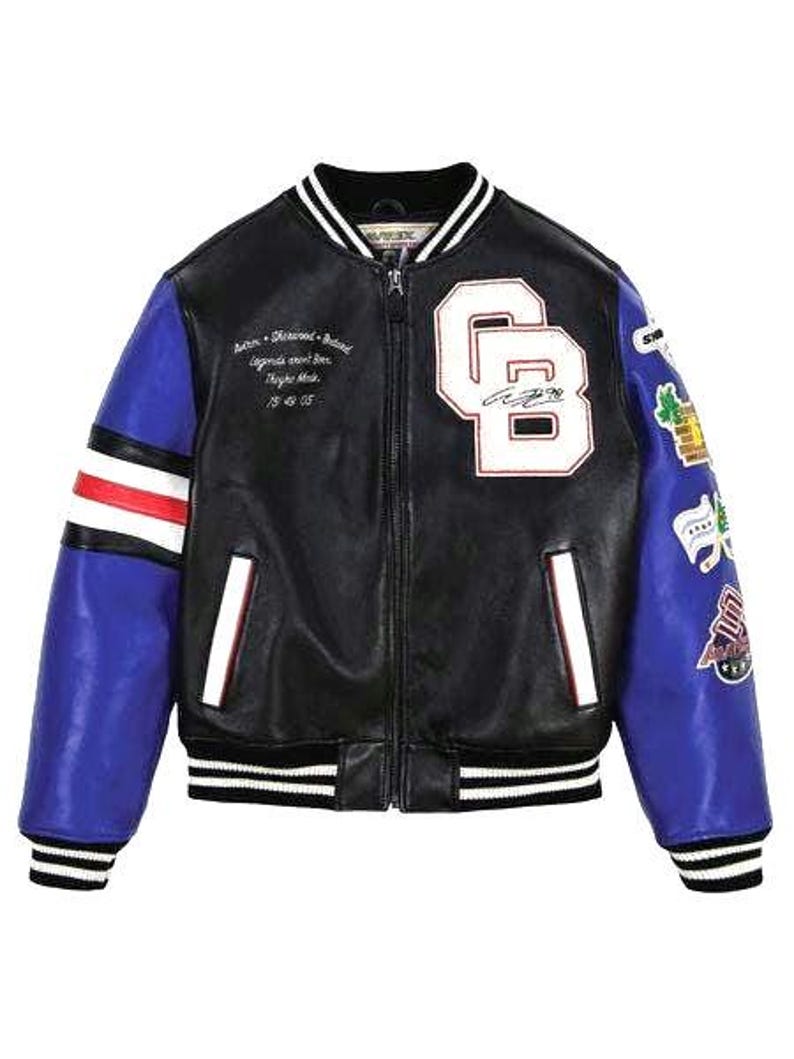 May include: Black and blue varsity jacket with white accents. Features a black body, blue sleeves with patches, and white stripes on the cuffs and hem. Includes a large "CB" patch and text on the chest.