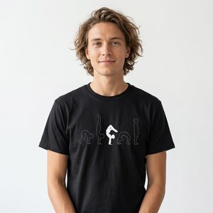May include: A black short-sleeved t-shirt featuring a white graphic print across the chest. The design consists of a sequence of five thin white line-art silhouettes depicting various gymnastic or yoga poses in a horizontal arrangement.