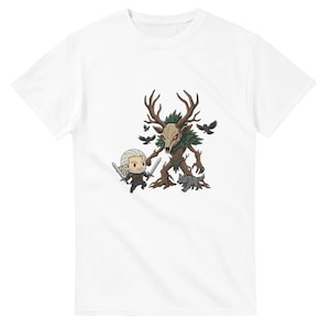 May include: White t-shirt featuring a cartoon illustration of a character with two swords facing a creature with antlers and a skull face. The illustration includes a wolf and several black birds. The design is in shades of brown, green, and gray.