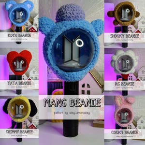 May include: A collection of handmade crochet light stick covers in various character designs. The covers include blue Koya, brown Shooky, red Tata, yellow Chimmy, white RG, pink Cooky, and blue Mang. Each cover is designed to fit over a light stick.
