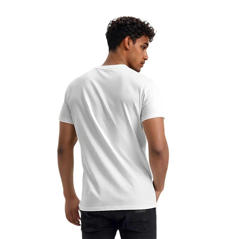 May include: A plain white crew neck t-shirt. The short-sleeved shirt is made of a soft material. The person is wearing black jeans. The background is white.
