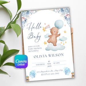 May include: A baby shower invitation with a watercolor design. The invitation features a brown bear holding a blue balloon, with the words "Hello Baby" in elegant script. Details include the date, time, and location.
