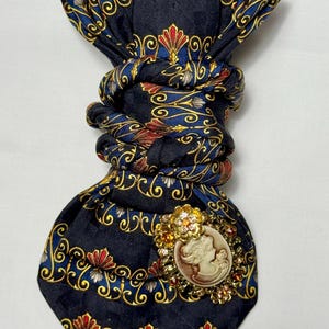 Custom Upcycled Necktie to be worn as a necklace or a brooch
