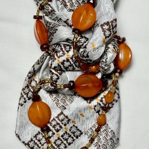 Custom Upcycled Necktie to be worn as a necklace or a brooch