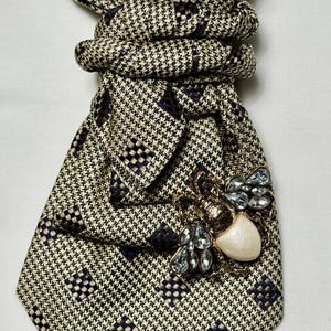 Custom Upcycled Necktie to be worn as a necklace or a brooch