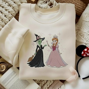 Wicked Elsa and Anna Embroidered Sweatshirt, Elphaba and Glinda Shirt, Frozen Elsa Sweatshirt, Frozen Anna Sweatshirt, Broadway Fan Gift image 1