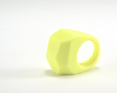 facet resin ring in sulphur yellow. chunky bold statement ring, opaque fluorescent yellow