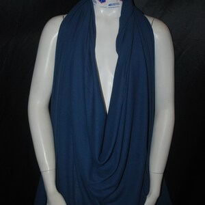 May include: A deep blue fabric draped over a mannequin. The fabric has a textured, waffle-like pattern.