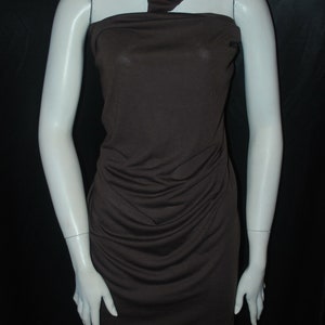May include: A brown sleeveless dress with a cowl neck and a fitted silhouette. The dress is made of a soft, stretchy fabric and has a smooth, wrinkle-free finish.
