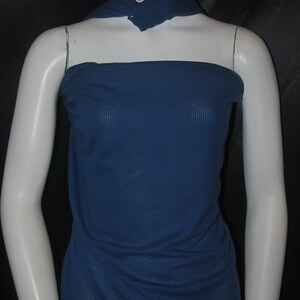 May include: A dark blue ribbed fabric swatch draped over a white mannequin torso. The fabric has a subtle texture and a smooth finish.