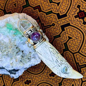 Handmade and unique snuff holder pendant.