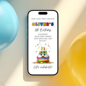 May include: A smartphone displays a birthday invitation with the text "Oliver's 10th Birthday." The invitation features a colorful cake made of toy blocks, confetti, and the words "Snap, Click, Twist, and Spin." Blue and yellow balloons are in the background.