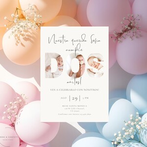 May include: A baby's second birthday invitation with a soft color palette. The invitation features the text "Nuestra querida Sofia cumple DOS años!" with three baby photos. The background includes pastel balloons and floral accents.