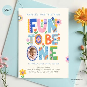 first birthday girl invite with photo featuring colorful balloons and cheerful party colors, editable drag and drop baby photo invite with matching thank you tag included and mobile phone invite included.