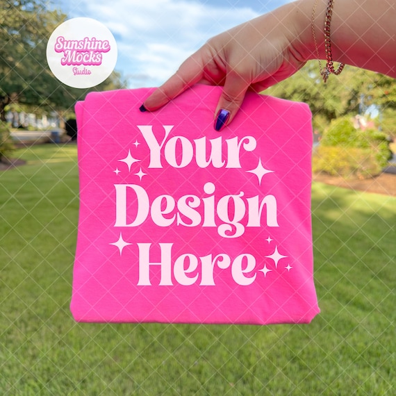 Neon Pink Comfort Colors 1717 Mockup | Hand Holding Folded Shirt | Neon Pink Shirt Mockup | Comfort Colors Mockup | Outdoor Summer Mock