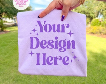 Orchid Comfort Colors 1717 Mockup | Hand Holding Folded Shirt Mockup | Purple Shirt Mockup | Orchid Comfort Colors Mockup | Outdoor Mockup