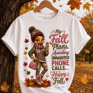 May include: A white t-shirt featuring a cartoon duck character wearing a green knit sweater, matching beanie, scarf, and pink boots. The graphic includes falling autumn leaves and the text: My Fall Plans. Avoiding UNWANTED PHONE CALLS... Happy Fall.