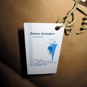 Peut inclure: Une carte de visite blanche avec du texte bleu et un graphique bleu. Le texte indique "Stefan Georgiev Designer S Gart Sofia bg 1 + 359 8 97 279 610 stefani_design@abv.bg www.sgartbg.com"