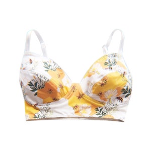 May include: A set of three ceramic mugs with a speckled, matte finish in cream, light grey, and dark grey. Each mug has a simple, minimalist design, suitable for coffee or tea.