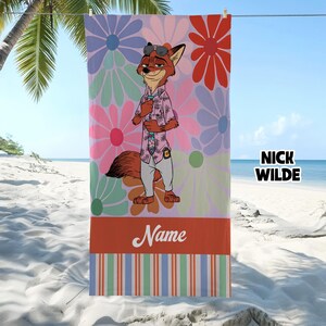May include: Beach towel featuring a cartoon fox character in a pink shirt and sunglasses, set against a floral background. The towel has a striped border and the text "Name" at the bottom, with "Nick Wilde" on the side.