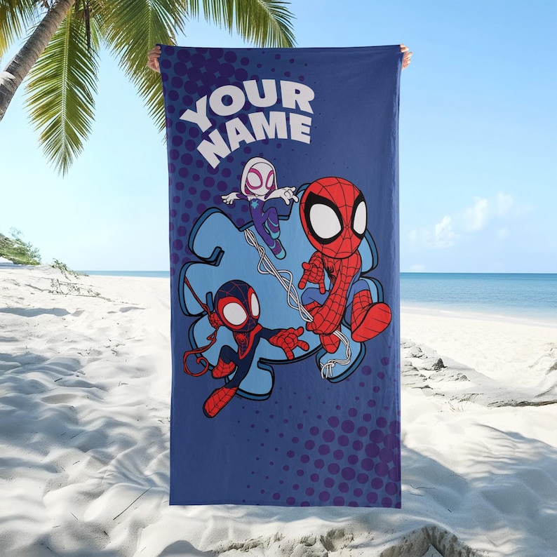 May include: A blue beach towel featuring cartoon Spider-Man characters. The towel has the text "YOUR NAME" at the top. The design includes Spider-Man, Spider-Gwen, and Miles Morales. The background has a dotted pattern.