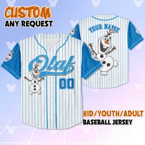May include: A white and blue baseball jersey featuring the name "Olaf" and the number "00". The jersey has a cartoon image of Olaf from Frozen. The sleeves are blue with white accents. The text "CUSTOM ANY REQUEST" is at the top.