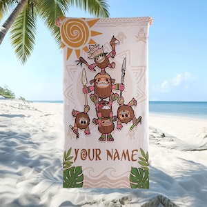May include: A beach towel featuring a cartoon illustration of several coconut-like characters stacked on top of each other, holding spears and weapons. The towel has a light beige background with a sun and tribal patterns. The text "YOUR NAME" is printed at the bottom.