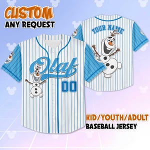 May include: A white and blue baseball jersey with the name "Olaf" and the number "00" on the front. The jersey features a cartoon image of Olaf the snowman. The sleeves are light blue with white stripes. The text "CUSTOM ANY REQUEST" is at the top.