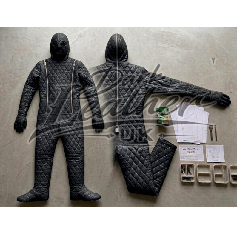 May include: Black quilted jumpsuit with a hood and full-face mask. The suit features a diamond pattern, a front zipper, and attached gloves. Additional items include patterns, small containers, and a can.