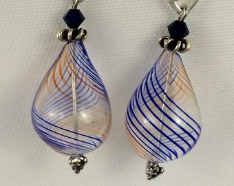 Light and lovely handblown blue and orange striped teardrop glass earrings.