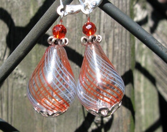 Light and lovely handblown orange and blue striped teardrop glass earrings.