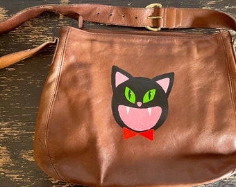 Black Cat: upcycled hand-painted Coach purse.