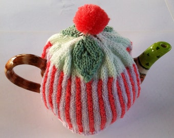 Stripy tea cozy with leaves and a pom pom