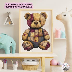 May include: A framed cross stitch pattern featuring a patchwork teddy bear with tan, brown, and purple fabric squares and small red heart accents. The text at the top reads PDF CROSS STITCH PATTERN INSTANT DIGITAL DOWNLOAD in black capital letters.