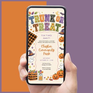 May include: A smartphone displaying a digital Trunk or Treat event flyer with a cream background, featuring colorful text, pumpkins, ghosts, bats, and candy illustrations. The flyer includes event details for Clayton Community Park on October 31.